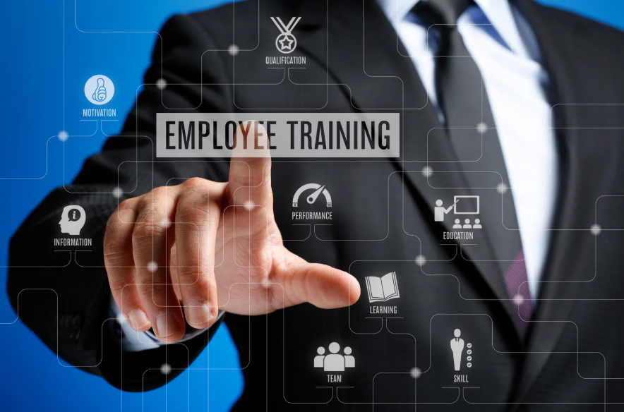 Picture of an individual touching the words Employee Training on a screen.