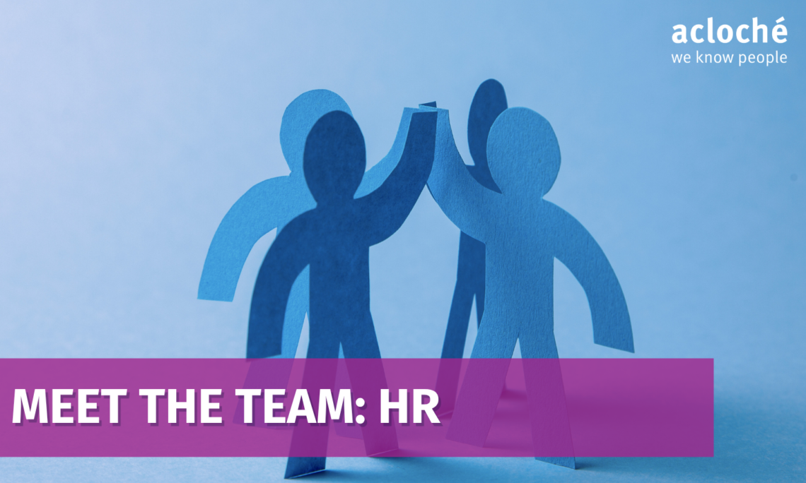 Blue paper-cutout figures high-fiving with a purple banner reading 'MEET THE TEAM: HR' and the 'acloché we know people' logo in the corner.